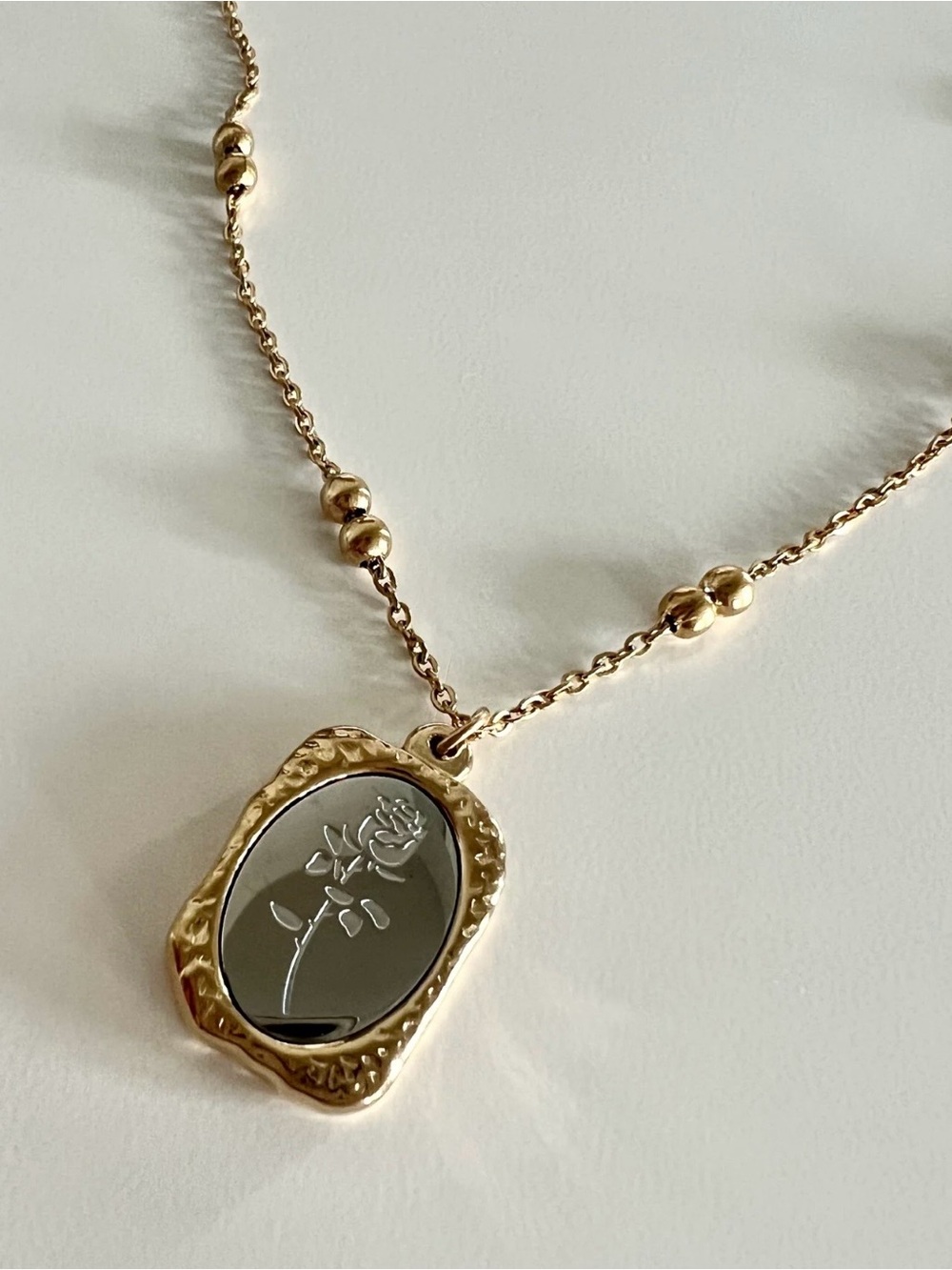 Plunder Gold-Tone Rose Engraved Pendant Necklace